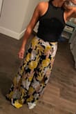 I was a little hesitant to buy these but I am glad I did. They are super cute and fit perfectly. I am about 115 lbs and I have a 27" waist and 32" hips so I'm kind of straight. The waist is on my true waist and a little tight but only because there is no stretch at all to the material. The slits do go very high up, but you only could tell when sitting and I have pretty small thighs so it wasn't a big deal. I'm only 5'4" so as you can see in the picture, without shoes on they came right down to the floor. - Caroline M.