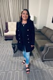 The material was good and did not feel cheap! The jacket fit right on the shoulders and length but I was not able to button it from the tummy area jacket fit a bit small. If you want to wear it open and a cute shirt under M fits me well but if you need it to button I would size it up. - Judith R.