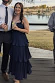 I purchased this dress for a friend's wedding. The style was a little out of my comfort zone, but it was stunning! I got a ton of compliments. Buy the dress, you won't regret it! - Coryn D.