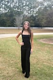 I bought this for my daughter's school pageant interview, and it was stunning on her. Ordered XXS and XS and sent the XS back. She's a size 0 in American Eagle jeans if that helps for comparison. - Jennifer N.