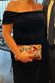 Fun pop of color! Good quality and comes with detachable gold chain strap. - Samantha O.