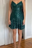 The color is a dark emerald green. The fit is great because it's a knit, stretchy fabric. - Erika M.