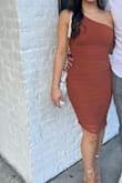 The dress fit so well and was very flattering! I wore spanks underneath just in case but probably didn't even need them because it hugged so well without being too tight. Also loved the color it was perfect for a fall themed rehearsal dinner - Elise M.