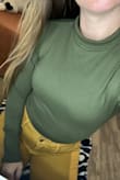 Love the olive green shade and the fact the collar can roll up or down. I could see myself wearing this for work or play, plus the bodysuit aspect makes sure nothing rides up. - Brandie R.