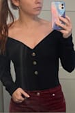 I bought this in black with a fall date night in mind. It is form-fitting and shows just the right amount of skin. I usually dress fairly conservatively so the little bit of cleavage and shoulder was perfect for a sexy look without making me feel self-conscious. It also stayed put on my shoulders and I didn't have to fuss with it which was appreciated. - Lindsay L.