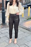 I've purchased "leather" pants from other places, and these are by far the best quality and most comfortable. They are definitely a little big at the waist. A small would have been fine, but it's not so bad that I would consider returning. - Jovana K.