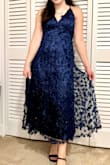I bought this dress to wear to a ball and ended up wearing something else. However, the dress was so stunning that I decided to keep it to wear to another event. The material does not wrinkle and the flowers are perfect! The dress also has some glitter which makes it sparkly. I'm on the shorter side so the dress was a bit longer on me than on the model, but it's a perfect dress for any height. I would totally recommend it! - Helena H.
