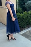 I thought this dress was so beautiful and I was not disappointed when it arrived! So many compliments on it and it fit so well! It has some stretch to it so I went with a S. Sleeves are just a tad tight but it wasn't bad at all to me. - Irania R.