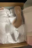 Photos look like they are more white. They are very much silver-like stainless steel - Amanda D.