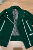 I couldn't figure out what didn't look right about the jacket and how it differed from the photos. After some thought, I think it may be the zippers. The lining around the zippers in the photos isn't as light as the real lining and the silver/chrome of the zippers really stands out making the jacket appear of lesser quality. I wanted to love this jacket but it's going back. - Maly A.