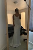 I was looking for a last minute elopement dress and bought a couple from Lulus. I ended up wearing a different long sleeve dress (also from Lulus) for my ceremony since it was during the winter. However, I still loved the way this dress fit on me and kept it instead of returning it, in hopes to use it for another event! The quality and material make the dress look a lot more expensive than what I bought it for! - Emma V.