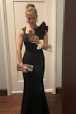 I bought this dress for a black tie wedding and it was PERFECT. It fit like a glove and was so flattering. I got compliments all night long. The material is thick and stretchy, so it was super comfortable. And the ruffled sleeve was the perfect amount of elegant flair. 100% recommend. I did have to get it hemmed because I'm a shorty and I prefer shorter heels. - Leighton O.
