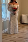 The dress was beautiful! I ended up getting it tailored with a new zipper as it was too tight on the top. The length was perfect with a small heel. Many compliments on the style. - Sarah C.
