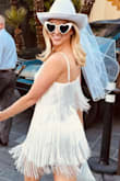First of all, I love how easy it is to order multiple dresses from Lulu's to try on and send back what doesn't fit. I ordered 4 dresses to try on for my Las Vegas elopement; this dress was the winner! I loved it! It was comfortable, fit perfectly, and so fun! Underneath the tassels were sequins for some extra sparkle. True to size. - M C.