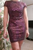 This dress was good quality, well-made, and gorgeous! It fit well but was a little loose in some areas. It was a little difficult to get on and off with all the sequins and beading and felt like removing chain mail but it wasn't heavy. It is a lot more sparkly than it appears in the picture. - Megan M.
