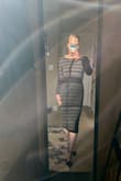 This dress gives me curves I didn't know I had. You can see light through the material, but it's still thick enough that nothing is showing. The boning at the back is great for holding its shape, and I see no problem with the sleeves slipping off. Obviously, it isn't made for petite people; the sleeves/skirt are long. The v at the back sits lower on me than the model, but it's still one of the prettiest things I've put on. :) - Kayris B.