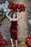 This dress fits very elegantly. The material is stretchy and adjusts well to the body contour. I am only 5'3" so it fit me a little longer than I would've liked but it wasn't bad. - Cheni T.
