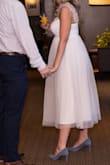 Was perfect for my bridal shower! My mum did have to take in the straps about 2 inches and then we cut the extra. All in all, it was still super fun, and it was something poofy (but not too poofy) and tea length. So, this was perfect! - Kate P.