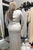 You wouldn't think this dress looks the way it did in person! Omg, it was stunning! So comfy! Just the right sparkle! I'm an apple figure which, with the help of some hip pads, made me look like an hourglass! I could have worn a regular bra. I didn't have on in the photo. I almost picked this dress! The pictures don't do justice to how beautiful this dress really is! If you are an apple like me, you gotta try it! - Casey H.