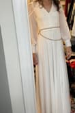 This dress is perfect. We are having a small backyard wedding and this is perfect for me. I like the back that ties in a bow because I have a flat chest and it was slightly loose but I was able to tie it slightly tighter to fit perfectly. It has a little weight to it and it's good quality I've bought other dresses from this company. - Lindsey S.