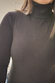 It looks lighter in the photo, but it is truly black. I thought it would be too long since I'm short, but it fit just fine. I could still see the outline of my bra, but it wasn't too noticeable. I ultimately returned it because the material felt too stiff and the snap button part was super thick. [There were] so many layers that the corners were hard, and I could feel it rub against my thighs. - Jamie L.