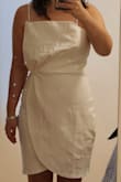 The dress fit well and zipped up easily, but it just didn't look as cute as in the picture. I felt like I was wearing an apron, and the top was just unflattering for me. - Jamie L.
