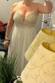I've been waiting forever for this dress to come back in stock. I've been waiting 2 years for my size. It's so pretty and looks great on. The sizing estimate is a little off. The zipper on the back has about a centimetre where it won't go all the way. I'm not worried about it because I'm working out to trim down post-baby.  Love it! Don't mind the sweat just worked out. - Jayne S.