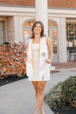 After reading the reviews, I decided to order two different sizes because I wanted to make sure I found the perfect size. The large was a little big so I stuck with the Medium, which is what I normally wear (I'm a 8/10). I absolutely adored this dress! It's so classy and made for great grad pics. I'm excited to wear it for graduation :) The fabric is thicker so you can't see through, except I wouldn't wear dark underwear. I highly recommend! - Jackie L.