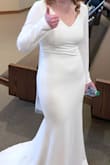 Color: it's a vanilla white, not a stark, harsh white - which is what we were hoping for! Fabric: thicker, sturdier, and higher quality than we expected for the price. Bride usually wears a medium (6/8), and this dress is true to size. She could have worn it out of the box, but we decided to have it altered so it fit her perfectly (pulled up the shoulders and shortened the hem in the front.) This was the perfect dress for her, and she looked stunning! After the wedding, I washed it on a delicate cycle, and it came out looking brand new. So very pleased with Lulus and this dress - I highly recommend!! - Jill D.