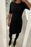 I have been in between sizes lately with Lulus (5'4", 116lbs) so after reading the reviews I decided to go with a small rather than my normal xs and I'm so glad I did. The dress fits perfectly. I have narrow hips so I'm always afraid the bottom will not fit right but this worked really well. The only reason I give this 4 stars is because the sleeves look a little too long. They could be shortened by about a half inch or so. It doesnt bother me that much since it's a work dress and I can always get them shortened if I want to. - Caroline M.