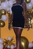 When I first saw this dress, I fell in love with it. And even more so when I tried it on after it was delivered! It is the perfect mix of classy, sexy, and modern. The rhinestone detailing at the top and bottom elevate this black dress into something really special. However, I will say that it was a little tight around my thighs, and sitting down was a bit constricting, but that's probably because my thighs are muscular. I still love this dress and will be wearing it again. - Merissa C.