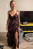 At first, I was looking for bright colors to make my tattoos stand out even more. But at my first glance, that dress on Lulu's Instagram post captivated my idea of showing up at my brother's wedding being so simply pretty and flawless for the theme of the wedding. Unfortunately, my size for that dress was out of stock, and put myself on the waitlist. But a miracle had happened that I got the dress in my hands in less than a week of being waitlisted! It's a feature of Lulu's company that I'm so appreciative of and would always keep coming back for! After trying on the dress, I was impressed with the styling of the concealed zipper on my side instead of my back, typically as in other dresses. Plus, I really liked how the sheer flower fabric blended the look with the dark plum stain color underneath the ruffles of the dress. I was floored by how I looked when I first looked at myself in the mirror, way better than I thought actually! - Jennida W.