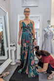 The dress fits impeccably at the top, flattering and comfortable. However, for a shorter person, the length is an issue, requiring an $80 alteration cost. While the price is fair, the additional expense dampens the overall value. - Maria G.