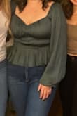 I wore this to my 10 year high school reunion and received endless compliments! The color is gorgeous, and the fit is very flattering. I have had two kids in the last two years and am self-conscious about my tummy, but this hid my little pooch and flattered my body type. It gave a little bit of cleavage but didn't look trashy. The only downside was that it was hard to wear with a bra, but some fashion tape fixed that. - Mary A.