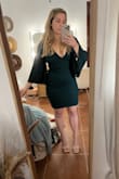 I was pleasantly surprised with this dress, because of my height and full hips sometimes "body con" style dresses aren't that flattering but this dress fit very well and was flattering! Even the length looks good and I don't think I will have to hem it which is a major plus but it's still long enough that it would work for the taller girlies out there. The material feels so nice, it's thick and good quality and the dress also has a liner that helps hide any bumps or lumps if you're worried about that sort of thing. It does have a pretty deep V-neckline but it's not too dramatic, just enough to be sexy. - Haley W.