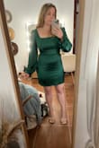 I bought this dress for a Christmas party and I really can't say enough good things about this dress. It's SO cute and flattering! The material is so so soft and the color is perfect, just as advertised. I have a hard time finding dresses that are the right length for me because I'm only 5' tall and the length of this dress was perfect. This being said, taller girlies beware because this dress does seem to run short. The only very minimal issue that I have with the dress is that it seems a little big in the bust area (for me with a 34B) which makes the shoulders fit a little loose and prone to slipping; however, when I tried it on with a pushup style bra the issue was fixed! So I'd say it's got extra room for the girls more blessed in the chest area and maybe a little baggie for the smaller-chested ladies.
Also, the sleeves are a *tad* long for me (short arms) but when the sleeves are tight enough when buttoned that it's not noticeable, and they stay in place around my wrists. - Haley W.