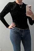 I'm out on bodysuits, but this one was so cute I had to try. I got a size small, I'm normally a med, because it's all that was in stock and actually it fits well! I think the medium would have been ok too, but I'm keeping the small. It's actually VERY comfortable. I have one other bodysuit that I refuse to wear because it fits uncomfortably. This one, I forgot it was a bodysuit. - Angela M.