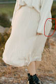 The stitching for the zipper bunched in between the layers of the skirt and created a bit of a fabric "bubble" that could be seen no matter what. The clasp above the zipper was hanging on by a thread when I received it. It served its purpose for my photo shoot, though. - Erin L.