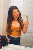 I have bought this leather crop top in all 3 colors I'm obsessed. However, when I purchased the usual size (medium) it was very boxy/big. So I returned it for a small. It's very fitted. - Kristin V.