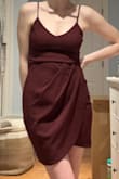This dress is adorable and flattering. I wish all spaghetti straps were like these, they're strong and reliable with just enough stretch. The color of the dress is a little more muted than what I was expecting, it's almost a rich mahogany red, not so plum purple. Closer to wine even. The asymmetrical cut is great, it's like a minidress without sacrificing mobility, you can go dancing in it and sit and stand without having to constantly adjust and pull it down. I love this dress! - Hannah T.