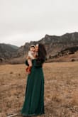 This dress was exactly what was described and beyond what I could have asked for. The material felt soft, comfortable, and built with quality. The color was true to what the website was showing. This is great for tall women and anyone trying to hide a little from the stomach area. I would recommend it to anyone! - Danielle F.