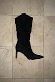 I am a 6.5 and bought a 7 based because the size chart said a 6.5 was a 37 and I was nervous it wouldn't fit so I sized up to 7/38 and while the shoe fits fine not super loose but with room the pointy tip is too long kind gives witchy vibes lol I just feel it throws off my proportions down there it could be me so I reordered and got the 6.5 in both black and white because ultimately it was the style I was going for and I can't find a western boot anywhere with a thin heel that's suede! I got my first pair on Black Friday on sale and now I'm repurchasing at full price so I hope that's enough to show that the quality is there and if ur thinking of buying it I'd get it. I wouldn't say they aren't wide calf friendly I have a pretty medium calf.. but again I did size up so there was a good amount of space to slide on and off so if you are worried the shoe (the black suede pair) may not have enough room I feel it is kinda workable if u get a size smaller. - Toi L.