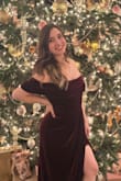 So I'm a size 4/6. It fit a little too snug in the waist last year when I was between 135-138 pounds, but now that I've lost some weight it fits perfectly! The material and dress are of good quality. I'm 5'3" and the very back is just above the floor without heels on. Just hard to raise my arms up, and a little awkward wearing a coat over it due to the off-the-shoulder design, but not too big of a deal. - Meredith E.
