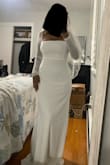 I bought this for my courthouse wedding for winter. The material is very nice and thick. Great quality and absolutely beautiful. A little slack on my waist; possibly could've gotten away with a small. Don't need to wear a bra with it. A little long, but nothing a pair of heels won't fix. - Nadine R.