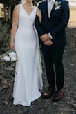 I ordered this dress on a whim as an "option" because it was less than $100. Surprisingly, it checked a lot of my boxes in what I was looking for in a wedding dress. I didn't have super high hopes, but I ended up liking it more than any of the way more expensive dresses I tried at higher end stores. It fit almost perfectly; all I needed to alter were the straps because they were a little too long. The length was perfect for me with 2-3 inch heels. The material felt very high quality without being too heavy, and it was very stretchy and easy to move and dance in! Literally couldn't have asked for a better dress! - Hanna H.