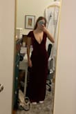 I wanted to LOVE this dress, the color is perfect, the velvet is so soft and it is fully lined and it was exactly what I was looking for, sleek and holiday red velvet. I ordered an xs. However, when trying it on, the neckline was far too deep and wide, the v ended below my sternum/rib and the bust apex was too high (especially for a dress without enough coverage to wear a bra) so the princess seam looked ill-fitted and loose on me. In fairness that's exactly how it looks in the model photo but on other reviews it looked a little better. Unfortunately, I had to return it. If I had more time before my Christmas party I might have attempted to have it tailored since I loved the fabric and the rest of the fit. - Cailyn M.