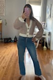 This sweater looks just like the picture. The fabric is soft, heavy, and looks much more expensive than it is. The puff sleeves are super cute, but with the stripes, it ends up looking a little clownish on me. I kept it because it's so comfortable and sits well on my waist. Overall, great quality! - Sara L.