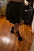 I think this fits true to size. That being said I bought a large because I didn't want it to cut into my stomach. The nice thing is that it doesn't hike up in the back, but then I don't have a big butt so that may be why.

Overall, a decent amount of fabric without being super, super short. - Christina V.