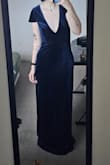 The dress fits very well and the v cut is perfect. I'm a bit short for the dress so I would've had to hem it but I'm returning it as I had purchased 2 dresses for multiple options for the event. I'm obsessed with the top part and the color and would also purchase the same dress again if it were short like a cocktail dress. - Rory C.