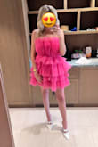 I got so many compliments on this dress during our vacation! It has a rubber strip around the top so it stays put. I wore 3-inch heels and it never felt too short. I want it in every color! - Lindsey V.
